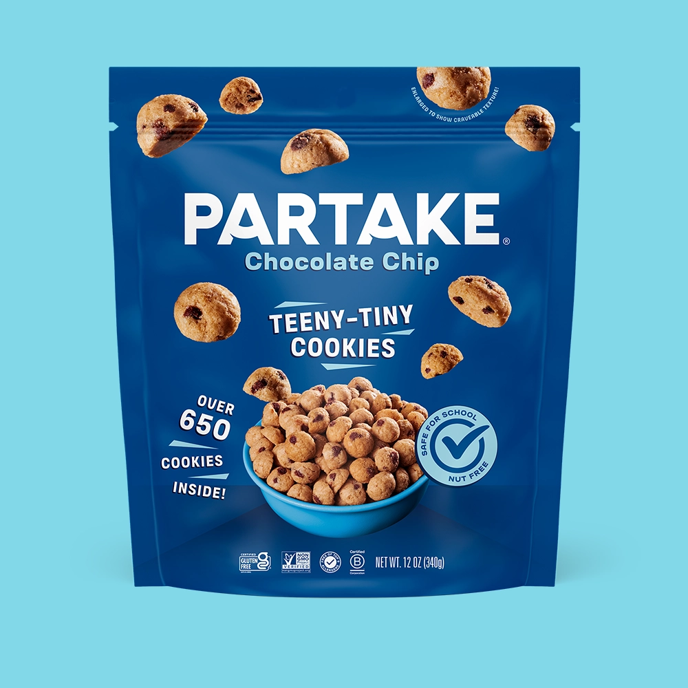 Teeny Tiny Crunchy Chocolate Chip pouch on a sky blue background