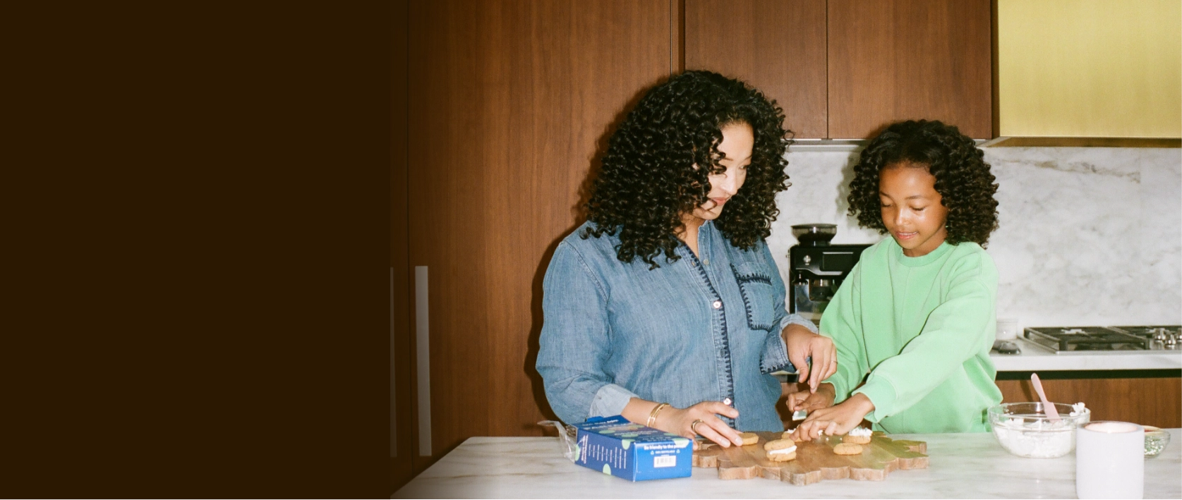 The Partake founder and her daughter in a kitchen preparing cookies together