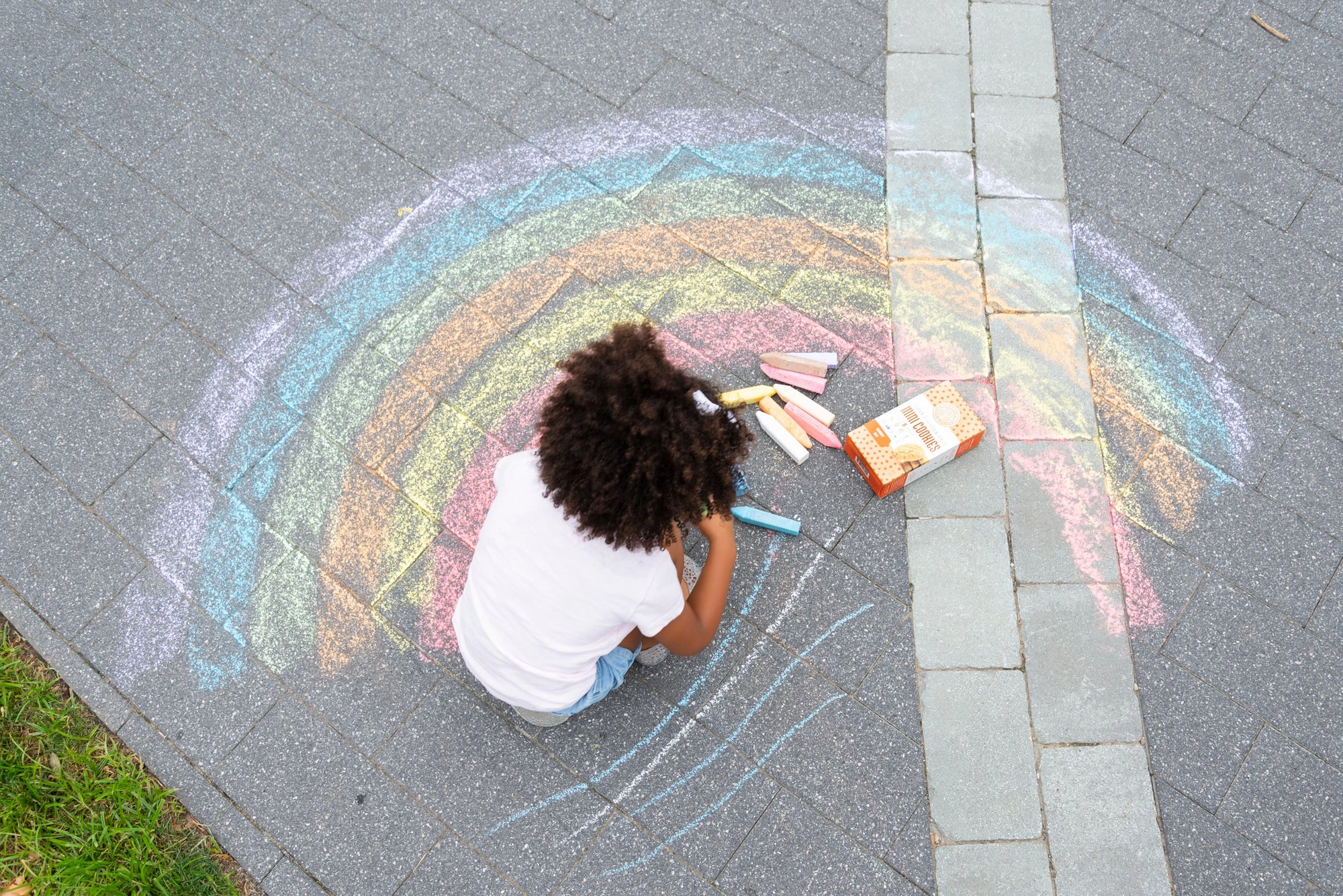 A child planting flowers outdoors on Earth Day